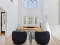 Bright living room with tall ceilings, large windows and comfortable seating at 2159 Hawthorne St, Sarasota, FL 34239