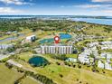 Aerial view of community near golf course, ponds, and other residential buildings, showcasing a well-planned community at 2320 Terra Ceia Bay Blvd # 305, Palmetto, FL 34221
