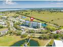 Aerial view showcasing the condo's prime location, surrounded by lush greenery, water features, and community amenities at 2320 Terra Ceia Bay Blvd # 305, Palmetto, FL 34221
