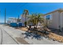 Inviting home exterior with a relaxing deck area and lush landscaping at 2601 Gulf N Dr # B24, Bradenton Beach, FL 34217