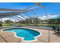 Inviting screened-in pool with views of the tranquil backyard pond and lush surroundings at 3606 Garden Lakes Clenet, Bradenton, FL 34203