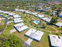 Beautiful aerial view of the community featuring mature landscaping and a refreshing community pool at 3626 Medford Ln # 1537, Sarasota, FL 34232