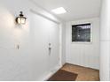Inviting entrance with neutral wall paint, exterior light, and a dark brown rug at 3626 Medford Ln # 1537, Sarasota, FL 34232