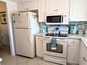 Well-lit kitchen showcases modern appliances and ample counter space for cooking at 3660 Lake Bayshore Dr # K-321, Bradenton, FL 34205