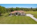Spacious single-Gathering home boasting a large manicured lawn and a long driveway, perfect for privacy at 4012 Twin Rivers Trl, Parrish, FL 34219