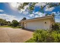 Beautiful home featuring an attached two car garage, barrel tile roof and well maintained lawn at 412 Giovanni Dr, Nokomis, FL 34275