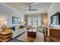 Bright living room with neutral tones and a ceiling fan, offering a cozy and inviting atmosphere at 5325 Marina Drive # 423, Holmes Beach, FL 34217