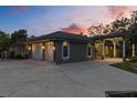 Expansive garage with an extended driveway, showcasing the home's ample parking and convenient covered entrance at 5442 Kent Rd, Venice, FL 34293