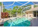 The backyard boasts a private pool and spa inside a screened enclosure, perfect for relaxation and entertainment at 622 147Th E St, Bradenton, FL 34212