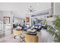 Airy living room showcasing modern decor, a ceiling fan, and seamless access to the outdoor patio area at 7257 Greystone St, Lakewood Ranch, FL 34202