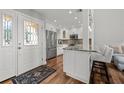 Beautiful kitchen featuring granite countertops, stainless steel appliances, and a stylish breakfast bar for casual dining at 1163 Coquille St # 207, Sarasota, FL 34242