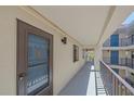 Exterior hallway with multiple unit doors at 1701 Beach Rd # 312, Englewood, FL 34223