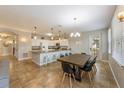 Inviting living and dining space with a kitchen island and access to outdoor spaces at 2309 Avenue C # 100, Bradenton Beach, FL 34217