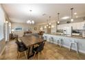 Spacious living and dining area with tiled floor, counter seating, and ample natural light at 2309 Avenue C # 100, Bradenton Beach, FL 34217