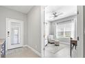 Bright office with large window, ceiling fan, neutral paint, and tile flooring at 2894 Butterfly Jasmine Trl, Sarasota, FL 34240