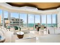 Elegant living room featuring comfortable seating and expansive ocean views at 435 L Ambiance Dr # H902, Longboat Key, FL 34228