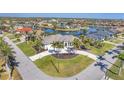 Picturesque aerial view of waterfront property with lush landscaping and waterway access in a vibrant community at 435 La Sila Ct, Punta Gorda, FL 33950