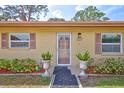 Close-up of the home's front entrance with neatly manicured landscaping and a welcoming walkway at 4420 Tecumseh Trl # 38, Sarasota, FL 34233