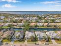 Aerial community view highlighting waterfront property with mature landscaping and waterway access at 4527 Barracuda Dr, Bradenton, FL 34208
