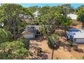 A lovely home with mature trees is showcased in this aerial view of the property at 480 58Th St, Sarasota, FL 34243
