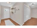 Inviting foyer with hardwood floors, closet, and stylish decor at 807 Harbor Ave, Ellenton, FL 34222