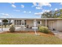 Inviting exterior view featuring covered entry and landscaped front yard, offering a welcoming curb appeal at 8517 Buckingham Pl, Palmetto, FL 34221