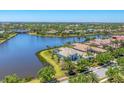 A stunning aerial view shows the home with water view in a beautiful community at 16436 Daysailor Trl, Lakewood Ranch, FL 34202