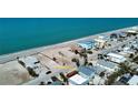 Aerial view showcases a charming coastal home, close proximity to the beach, and surrounding neighborhood at 1107 Shore View Dr, Englewood, FL 34223
