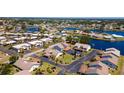 Beautiful aerial view of the community with waterfront homes and mature trees at 1770 Lake Pl # 1770D, Venice, FL 34293