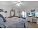 Bedroom featuring a ceiling fan, TV and access to an outdoor area at 204 46Th Avenue W Ter # 412, Bradenton, FL 34207