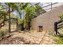 Private patio featuring a grill and stone flooring at 323 Bobby Jones Rd # 323, Sarasota, FL 34232