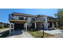 Condo community featuring covered parking and a landscaped exterior at 3390 Ramblewood Ct, Sarasota, FL 34237