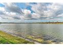 Scenic view of the tranquil lake, showcasing the property's prime waterfront location and serene surroundings at 344 Maraviya Blvd, Nokomis, FL 34275