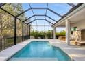 Relaxing screened-in pool area, perfect for outdoor entertainment and leisure at 5203 Title Row Dr, Bradenton, FL 34210