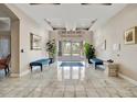 Elegant lobby featuring marble floors, stylish seating, and abundant natural light at 808 3Rd W Ave # 214, Bradenton, FL 34205