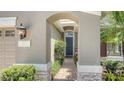 Inviting front entryway with brick walkway and manicured landscaping at 12041 Thornhill Ct, Lakewood Ranch, FL 34202