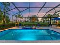 Sparkling pool and spa with screened enclosure and picturesque golf course views at 15024 Castle Park Ter, Lakewood Ranch, FL 34202
