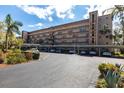 Attractive condo building with covered parking spaces and nicely maintained landscaping surrounding the property at 3620 Ironwood Cir # 606, Bradenton, FL 34209