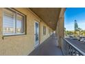 The exterior hallway provides access to residential units with a view of the parking area at 3763 Lake Bayshore Dr # 310, Bradenton, FL 34205