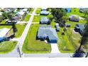 Charming home aerial view, showcasing the lush lawn and inviting neighborhood at 4404 5Th W Ave, Palmetto, FL 34221