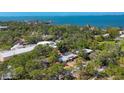Aerial view of the property showing its proximity to the waterfront and surrounding landscape at 448 58Th St, Sarasota, FL 34243