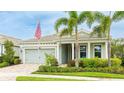 Inviting single-story home with manicured landscaping, a two-car garage, and a welcoming front porch at 5416 Hope Sound Cir, Sarasota, FL 34238
