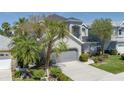 Charming two-story home boasts a well-maintained lawn and an attached two-car garage at 6210 Laurel Creek Trl, Ellenton, FL 34222