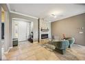 Inviting living room with tile flooring, a stone fireplace, and plenty of natural light at 6381 Mighty Eagle Way, Sarasota, FL 34241