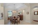 Light-filled dining room with an elegant chandelier and direct access to the rest of the home at 14404 18Th E Pl, Bradenton, FL 34212
