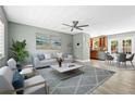 Bright living room showcasing a modern ceiling fan, contemporary decor, and an open floor plan at 2303 Stratford Dr, Sarasota, FL 34232