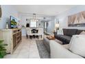 Inviting open-plan living and dining area with modern decor and plenty of natural light at 323 Timberlake Dr # 323, Bradenton, FL 34210