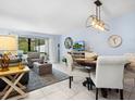 Comfortable living and dining area with ample seating, modern decor, and bright natural light at 323 Timberlake Dr # 323, Bradenton, FL 34210