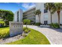 Well-manicured landscaping and an inviting entrance welcome you to Portobello 3235 at 3235 Gulf Of Mexico Dr # A305, Longboat Key, FL 34228