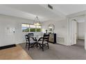 Cozy dining area with contemporary decor adjacent to the entry and living spaces at 3235 Gulf Of Mexico Dr # A305, Longboat Key, FL 34228